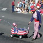 kid in wagon at parade